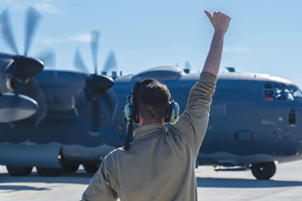 A 4th Special Operations Maintenance Squadron Airman directs a 4th Special Operations Squadron AC-130J Ghostrider gunship, as it prepares to taxi at Hurlburt Field, Florida, Dec. 4, 2024. The aircraft was used in a Next Generation Aircrew Protection team test to evaluate the effectiveness of chemical stimulant vapor purge systems during flight. (U.S. Air Force photo by Airman Samantha Rossi)